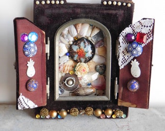 Shrine to a Glass Flower Assemblage made from a Victorian Velvet Cabinet Frame Adorned with Glass, Beads, Shell, Crystal, Rhinestones & More