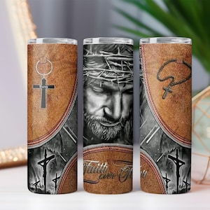 May include: Three stainless steel tumblers with religious imagery. One features a cross pendant, another a detailed depiction of Jesus wearing a crown of thorns, and the third a rosary. The tumblers have a brown leather-like texture with the words "Faith Ever For" on the center tumbler.