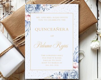 May include: A blue and pink floral Quinceañera invitation with gold lettering. The invitation reads "MR. AND MRS. ROJAS INVITE YOU TO CELEBRATE THE QUINCEAÑERA OF Paloma Rojas THE LORENZO HALL 3948 PARTY ROAD, DALLAS TX 39439 RSVP TO MARIA AT 304-393-3930"