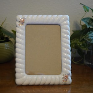 Vintage ceramic floral picture frame.