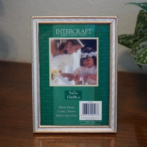 Intercraft 5X7 brass and mother of pearl vintage picture frame.