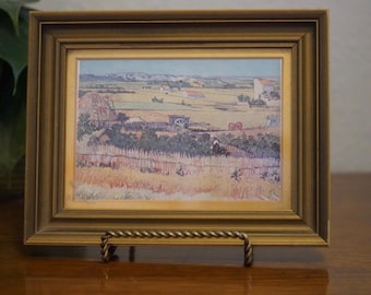 Print of Vincent van Gogh's "The Harvest” in vintage frame.
