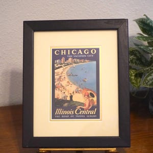 Vintage framed travel poster advertising Chicago as &quot;The Vacation City&quot; by the Illinois Central Railroad