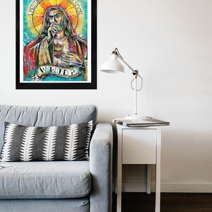 May include: A framed print of a colorful painting depicting a man with a beard and long hair, holding a microphone and wearing a red robe. The text "I MUSTICHE YOU A QUESTION" is written in a circle around the man's head. The text "WILL YOU?" is written below the man.