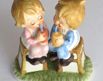 HOMCO Hand Painted Matte Porcelain Girl and Boy with Drinks