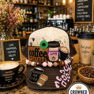 May include: A brown and cream trucker hat featuring coffee-themed patches, including text that reads coffee weather, pumpkin latte, and coffee for life. The hat is decorated with a string of beads and pink leopard print accents on the lower front panel.