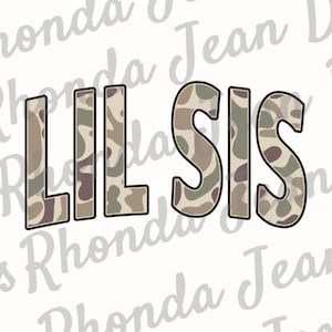 May include: The words "Lil Sis" in a camouflage pattern font.