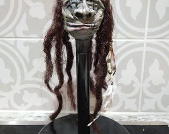 Shrunken Head Wizard with feathers on mount mounted
