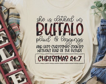 She is clothed in buffalo plaid & leggings Christmas T-Shirt