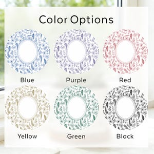May include: The image displays six circular designs with floral patterns in various colors: blue, purple, red, yellow, green, and black. Each design has a white, oval-shaped center and is labeled with its respective color. The text "Color Options" is at the top.