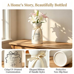 May include: A white ceramic vase with a scalloped rim, holding white and pink lilies. The vase features a cream-colored ribbon tied around the neck and a black graphic print that reads Engaged, Vivian & Oscar, 12.16.2023, with two champagne flutes.