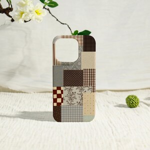 May include: A rectangular phone case featuring a patchwork design of various brown, beige, and cream patterns. The surface displays a mix of checks, polka dots, floral motifs, and solid blocks, creating a multi-textured appearance with a camera cutout.