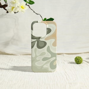 May include: A phone case with a swirling abstract design in shades of green, beige, and cream. The case has cutouts for the camera and buttons. The overall aesthetic is modern and artistic.