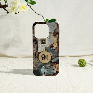 May include: A phone case featuring a collage of images and text. The design includes a gold-colored stag, a blue car, and the text "9 3/4". The background is a mix of vintage-style paper and illustrations, with the word "Hogwarts" visible.