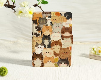 May include: A rectangular case featuring a repeating pattern of cartoon cats in various colors, including orange, brown, gray, and black. The cats have different expressions and markings. The case has a magnetic closure.