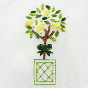 May include: Embroidered lemon tree with green leaves and yellow lemons, in a green pot with a diamond pattern.