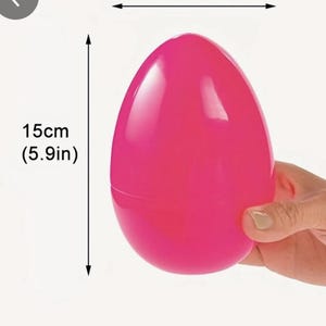 May include: A bright pink plastic Easter egg measuring 10cm (3.9in) wide and 15cm (5.9in) tall.