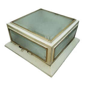 May include: A square ceiling light fixture featuring a white frame with metallic gold-toned trim and frosted glass panels on the top and four sides. The fixture has a stepped base design and includes a small metal latch on one of the side panels.
