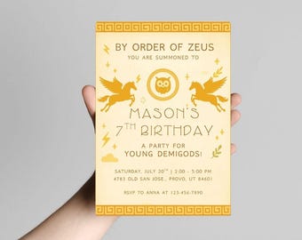 May include: A gold-colored birthday invitation with the text "By Order of Zeus" and "Mason's 7th Birthday." The design includes illustrations of winged horses, lightning bolts, and an owl. The invitation also includes the date, time, and location.