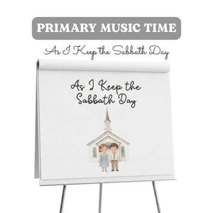 Op de afbeelding: Een wit flipoverbord op een standaard met de tekst PRIMARY MUSIC TIME en As I Keep the Sabbath Day. De pagina bevat een aquarelillustratie van een kerkgebouw met twee figuren ervoor, gekleed in blauwe en beige kleding.