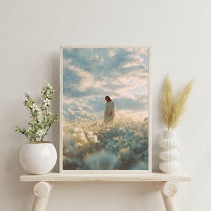 May include: Framed art print featuring a person in a white robe standing in a field of white flowers under a cloudy sky. The artwork is displayed on a wooden shelf with decorative vases.