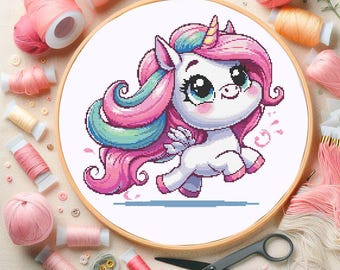May include: A cross-stitch pattern featuring a cartoon unicorn with a pink, blue, and green mane and tail. The unicorn is running and has a white body with a pink blush on its cheeks.