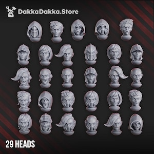 May include: A collection of 29 gray miniature heads, each with unique hairstyles, helmets, and facial expressions. The heads are arranged in rows and columns against a dark background. The text "DakkaDakka.Store" and "29 HEADS" are visible.