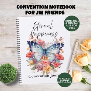 May include: A spiral-bound notebook with the text "CONVENTION NOTEBOOK FOR JW FRIENDS" and "Eternal Happiness." The cover features a watercolour butterfly design with floral accents. A pen and roses are next to the notebook. The notebook is for 2026 and has 85 pages.