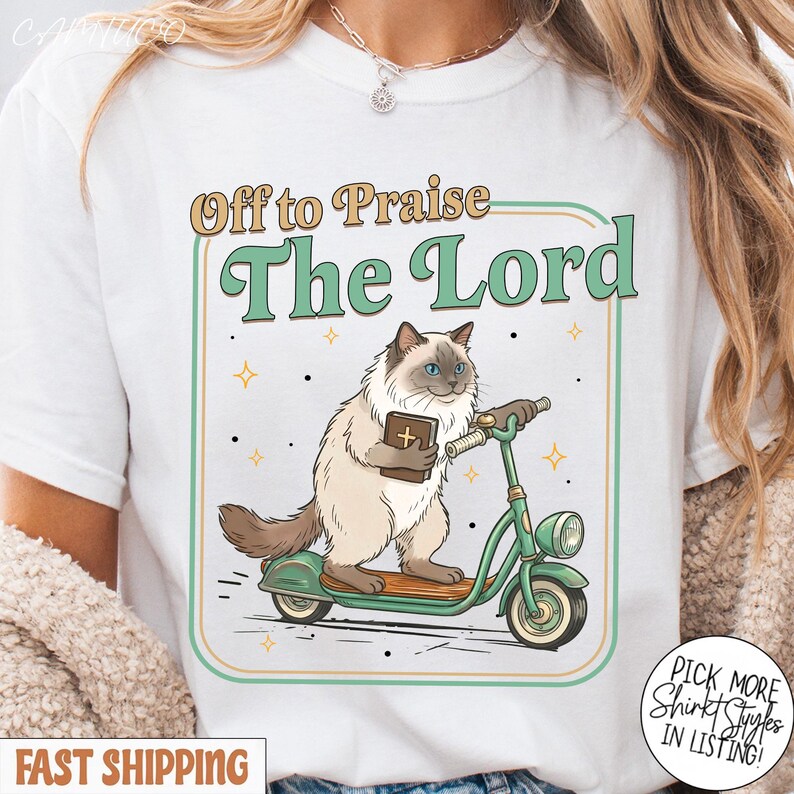 May include: White t-shirt with a graphic of a cat riding a green scooter and holding a book. The text "Off to Praise The Lord" is above the cat. Additional text reads "Pick More Shirt Styles In Listing!" and "Fast Shipping".