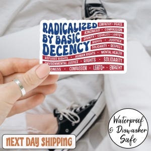 May include: A white sticker with the text "RADICALIZED BY BASIC DECENCY" in blue, with red text listing values like "EMPATHY" and "EQUALITY." The sticker is held by a hand, with a ring visible. A black and white shoe is in the background. The sticker is waterproof and dishwasher safe.