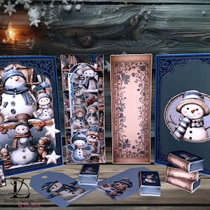 May include: A collection of winter-themed paper crafts featuring snowmen. The set includes framed art, bookmarks, gift tags, and small boxes. The color palette is primarily blue, white, and brown, with a rustic wooden background.
