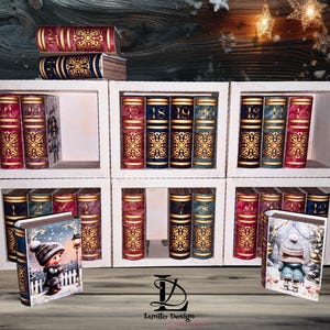 Puede incluir: Una estantería blanca llena de libros decorativos de varios colores. Los libros tienen detalles dorados y están dispuestos en forma de cuadrícula. Dos libros pequeños con escenas invernales están frente a la estantería.