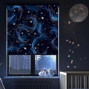 May include: A dark blue window shade with a white starry night sky design. The shade is pulled down and the window behind it shows a view of trees outside. There are two stuffed animals sitting on a window sill in front of the shade.
