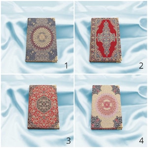 May include: Four different patterned notebooks with gold trim. The notebooks have a variety of colors and patterns, including red, blue, and gold. The notebooks are arranged in a grid pattern.