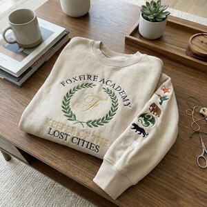 Embroidered Foxfire Academy Sweatshirt, Lost Cities Keeper Fan Gift, Fantasy House Crest Crewneck, Book Lover Apparel Blue