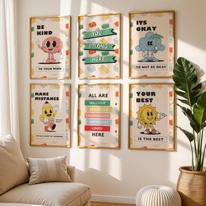 Könnte beinhalten: Sechs gerahmte Poster mit positiven Botschaften und Cartoon-Charakteren. Die Poster enthalten Sätze wie "Sei nett", "Du gehörst hierher" und "Mach Fehler". Die Kunstwerke zeigen ein Gehirn, eine Wolke, einen Bleistift und eine Sonne.
