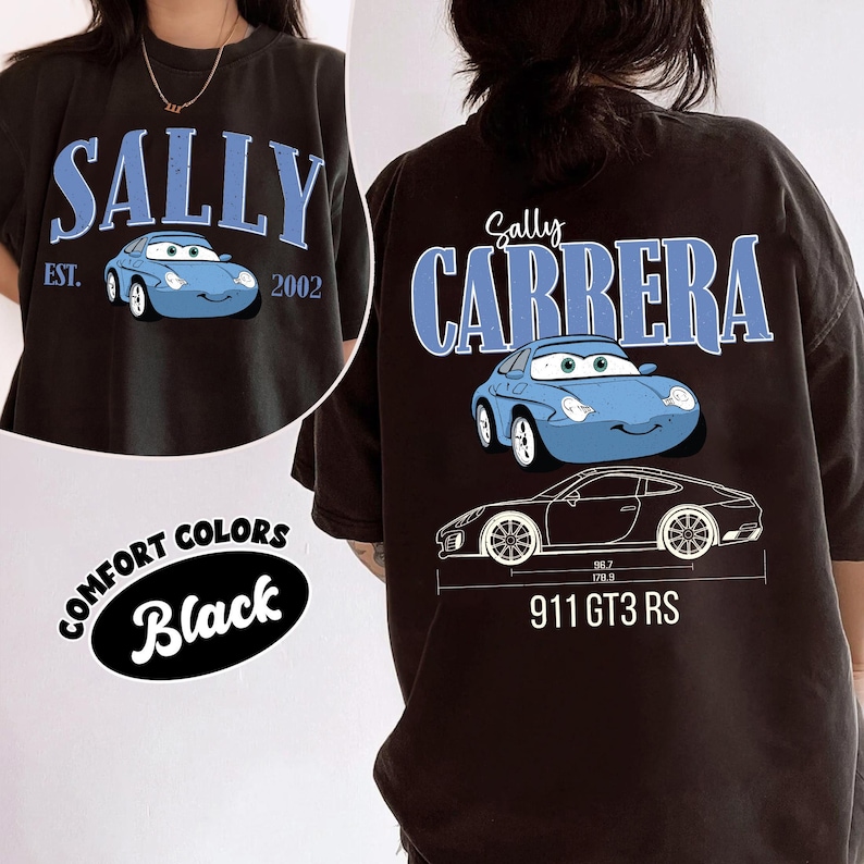 May include: Black t-shirt featuring a blue cartoon car with the name "SALLY" above it and the text "EST. 2002". The back of the shirt has the text "Sally CARRERA" above the same car graphic and a car blueprint with the text "911 GT3 RS".