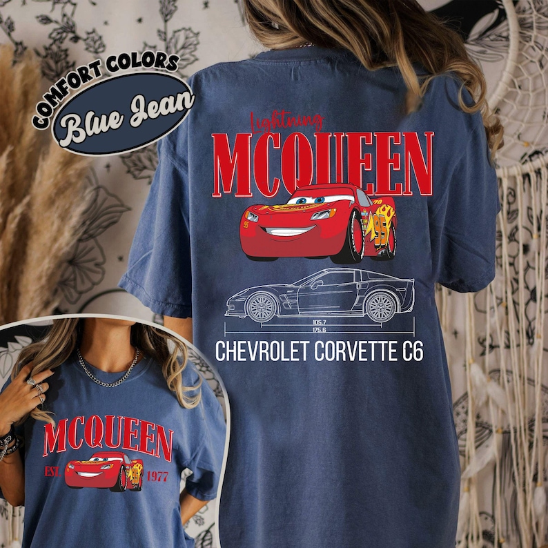 May include: Blue jean t-shirt featuring a red Lightning McQueen graphic and the text "McQueen". The back of the shirt displays a larger McQueen graphic, the text "Chevrolet Corvette C6", and a car blueprint.