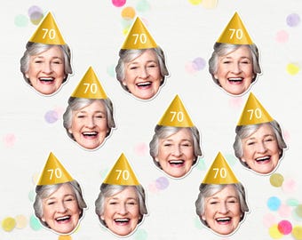 May include: Nine gold party hats with the number 70 printed on them. Each hat is worn by a smiling woman with white hair.
