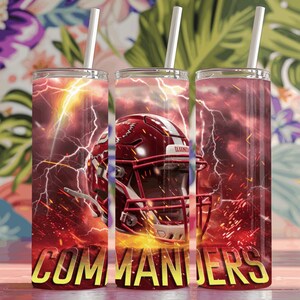May include: Three red and white insulated tumblers with a football helmet graphic and the word "COMMANDERS" in yellow. The background is a red and white lightning bolt design.