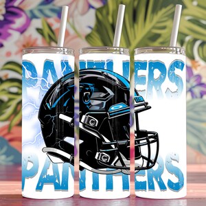 May include: Three white tumblers with a Carolina Panthers logo and the words "Panthers" on them. The logo is a black and blue football helmet with a panther face on it.