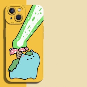 May include: Yellow phone case featuring a cartoon character with a blue body, green leaves, and a pink and brown mushroom. A green and white design is above the character. The case has a dual camera and the words "DUO camera".