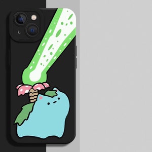 May include: Black phone case featuring a cartoon character with a blue body, green leaves, and a pink and brown flower. A green beam of light is above the character. The phone case has a black camera module.