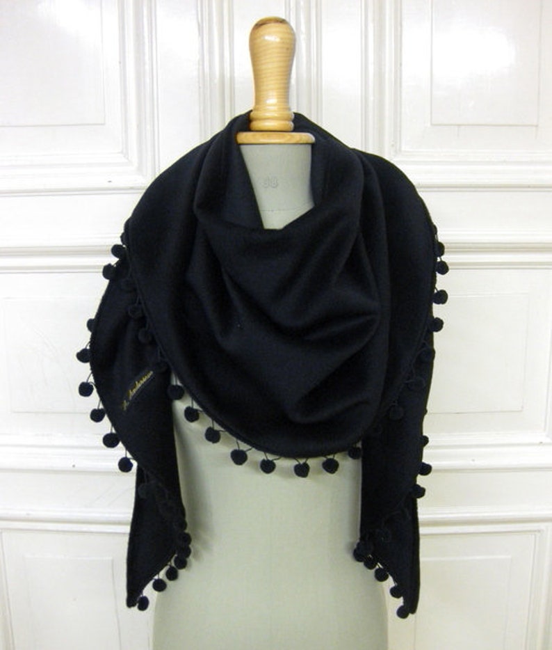 woolshawl with pompons in black image 1