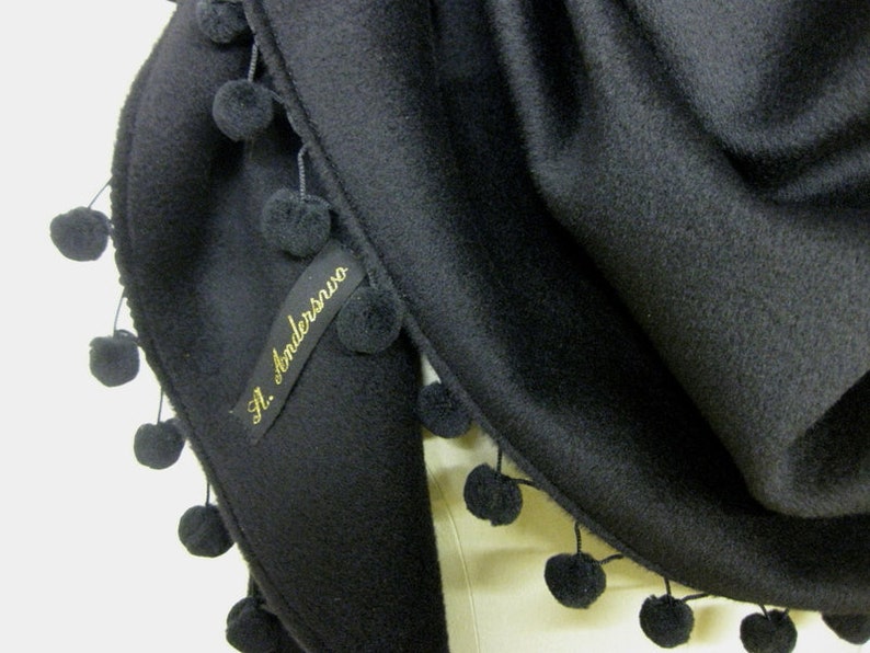 woolshawl with pompons in black image 3