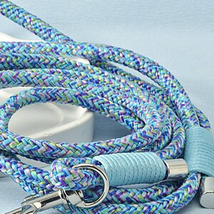 Unisex dog leash rolled up for storage, lightweight and travel-friendly.