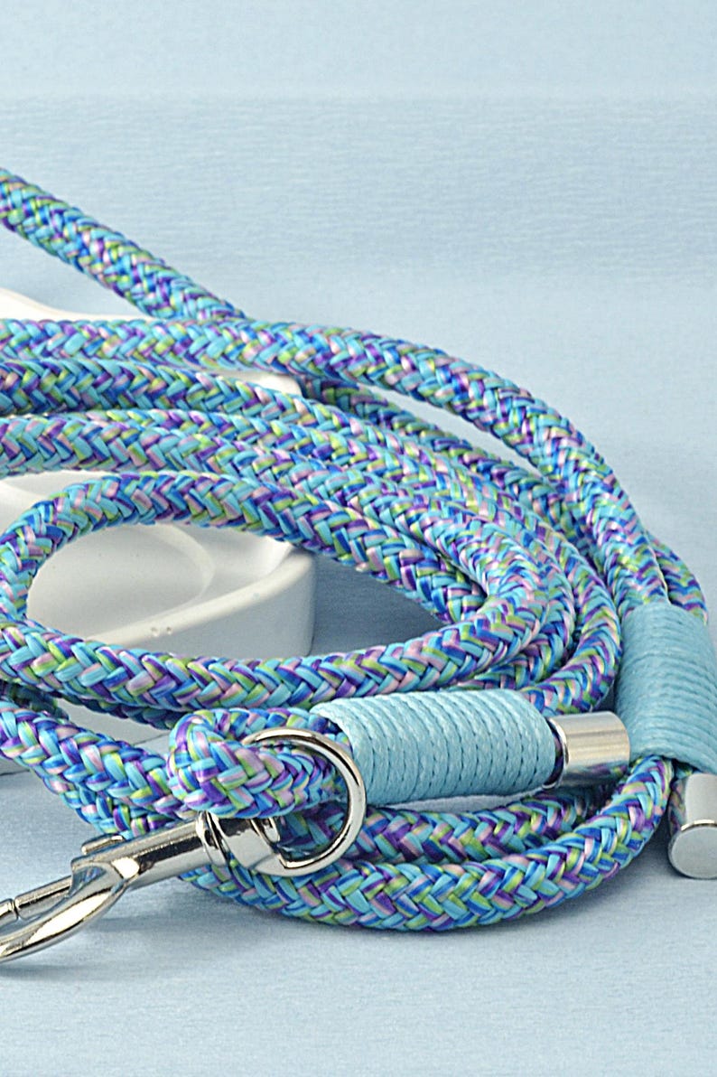 Unisex dog leash rolled up for storage, lightweight and travel-friendly.