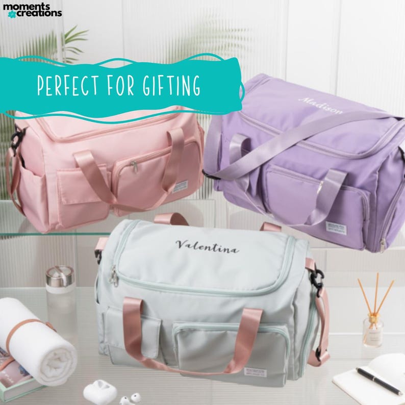 May include: Three duffel bags in pastel colors: pink, lavender, and mint green. Each bag has a top handle, a shoulder strap, and multiple pockets. The bags are personalized with names in script. The text "PERFECT FOR GIFTING" is displayed.