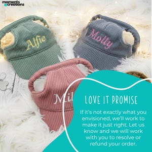 May include: Three corduroy dog hats in green, gray, and pink, each embroidered with a pet's name: Alfie, Molly, and Mil. The hats have a visor and a loop for the dog's ears. The image includes the text "LOVE IT PROMISE".