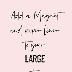 May include: A light pink background with black handwritten text that reads: "Add a Magnet and paper liner To your LARGE tin."